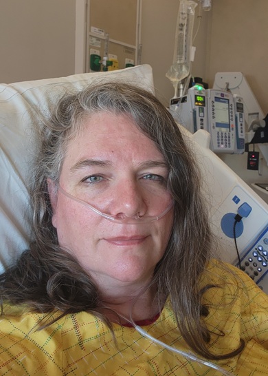 Anna in her hospital bed